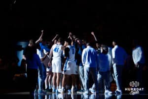 Creighton gathers together for a huddle pregame. Creighton men's basketball hosts Marquette at CHI Health Center on Saturday, Dec 20, 2025, in Omaha, Nebraska. Photo by Kyle Byers.