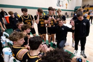 Gretna Eat head coach Cooper Anthony talks with his team at the end of the fourth quarter during a high school basketball game Thursday, December 11, 2025, in Lincoln, Nebraska. Photo by Braden Cochran.