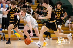 A Lincoln Pius X attacker tries to move past Griffin defenders during a high school basketball game Thursday, December 11, 2025, in Lincoln, Nebraska. Photo by Braden Cochran.