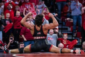 Nebraska Cornhusker AJ Ferrari celebrates beating North Carolina Tar Heel Mikey Calcagno during a college wrestling duel on Friday, Dec 19, 2025, in Lincoln, Nebraska.