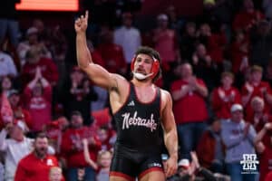 Nebraska Cornhusker AJ Ferrari celebrates beating North Carolina Tar Heel Mikey Calcagno during a college wrestling duel on Friday, Dec 19, 2025, in Lincoln, Nebraska.