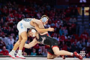 Nebraska Cornhusker Tyler Eise attacks North Carolina Tar Heel Jake Dailey during a college wrestling duel at 184 on Friday, Dec 19, 2025, in Lincoln, Nebraska.