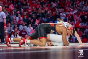 Nebraska Cornhusker Christopher Minto attacks North Carolina Tar Heel Collin Carrigan during a college wrestling duel at 174 on Friday, Dec 19, 2025, in Lincoln, Nebraska.