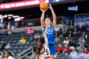 Creighton Bluejay Neleigh Gessert (23) shoots a jumpshot over Sarai Estupiñan (5) during a basketball game against Omaha on Wednesday, Dec 17, 2025, in Omaha, Nebraska. Photo by Brandon Tiedemann.