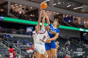 Creighton Bluejay Elizabeth Gentry (35) looks to get a rebound over Ali Stephens (11) during a basketball game againstOmaha on Wednesday, Dec 17, 2025, in Omaha, Nebraska. Photo by Brandon Tiedemann.