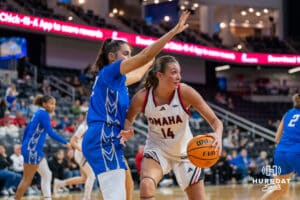 Omaha Maverick Avril Smith (14) looks to pass during a basketball game against Creighton on Wednesday, Dec 17, 2025, in Omaha, Nebraska. Photo by Brandon Tiedemann.