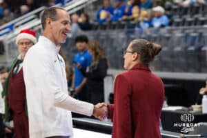 Creighton Bluejay head coach Jim Flanery and Omaha Maverick head coach Jamie Carey shake hands before a basketball game on Wednesday, Dec 17, 2025, in Omaha, Nebraska. Photo by Brandon Tiedemann.