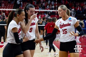 Nebraska Cornhuskers Harper Murray and Andi Jackson comfort Virginia Adriano after the loss to Texas A&M Aggies during the NCAA Volleyball Regional on Sunday, Dec. 14, 2025, in Lincoln, Nebraska. Photo by John S. Peterson.