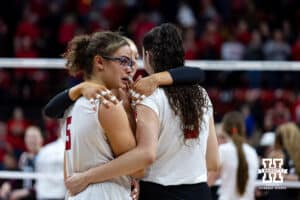Nebraska Cornhusker Rebekah Allick (5), Virginia Adriano, and Andi Jackson comfort each other after the loss against the Texas A&M Aggies after five sets during the NCAA Volleyball Regional on Sunday, Dec. 14, 2025, in Lincoln, Nebraska. Photo by John S. Peterson.