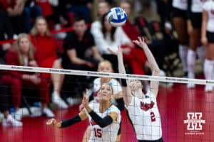 Nebraska Cornhusker setter Bergen Reilly (2) sets the ball for middle blocker Andi Jackson (15) against the Texas A&M Aggies in the fourth set during the NCAA Volleyball Regional on Sunday, Dec. 14, 2025, in Lincoln, Nebraska. Photo by John S. Peterson.