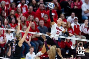 Nebraska Cornhusker middle blocker Andi Jackson (15) spikes the ball against the Texas A&M Aggies int the third set during the NCAA Volleyball Regional on Sunday, Dec. 14, 2025, in Lincoln, Nebraska. Photo by John S. Peterson.