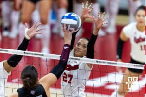 Nebraska Cornhusker outside hitter Harper Murray (27) jumps to block against the Texas A&M Aggies during the NCAA Volleyball Regional on Sunday, Dec. 14, 2025, in Lincoln, Nebraska. Photo by John S. Peterson.