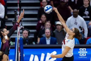 Nebraska Cornhusker middle blocker Rebekah Allick (5) spikes the ball against the Texas A&M Aggies in the second set during the NCAA Volleyball Regional on Sunday, Dec. 14, 2025, in Lincoln, Nebraska. Photo by John S. Peterson.