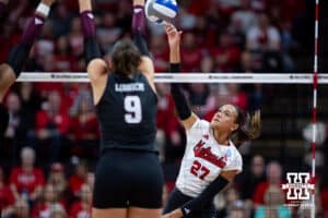 Nebraska Cornhusker outside hitter Harper Murray (27) spikes the ball against Texas A&M Aggie opposite Logan Lednicky (9) in the second set during the NCAA Volleyball Regional on Sunday, Dec. 14, 2025, in Lincoln, Nebraska. Photo by John S. Peterson.