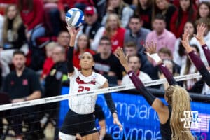 Nebraska Cornhusker outside hitter Harper Murray (27) bumps the ball over the net against the Texas A&M Aggies in the first set during the NCAA Volleyball Regional on Sunday, Dec. 14, 2025, in Lincoln, Nebraska. Photo by John S. Peterson.