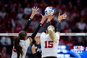 Nebraska Cornhusker outside hitter Harper Murray (27) and middle blocker Andi Jackson (15) jump up to block against the Texas A&M Aggies in the first set during the NCAA Volleyball Regional on Sunday, Dec. 14, 2025, in Lincoln, Nebraska. Photo by John S. Peterson.