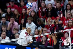 Nebraska Cornhusker outside hitter Taylor Landfair (12) spikes the ball against the Texas A&M Aggies in the first set during the NCAA Volleyball Regional on Sunday, Dec. 14, 2025, in Lincoln, Nebraska. Photo by John S. Peterson.