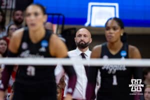 Texas A&M Aggie head coach Jamie Morrison watches the action on the court against the Nebraska Cornhuskers during the NCAA Volleyball Regional on Sunday, Dec. 14, 2025, in Lincoln, Nebraska. Photo by John S. Peterson.