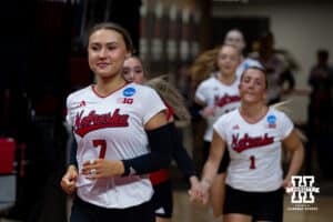 Nebraska Cornhusker defensive specialist and senior Maisie Boesiger (7) lead the Huskers out for the last time to take on the Texas A&M Aggies during the NCAA Volleyball Regional on Sunday, Dec. 14, 2025, in Lincoln, Nebraska. Photo by John S. Peterson.