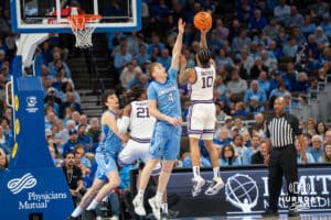 Creighton Bluejay Josh Dix (4) contests a shot during a basketball game against Kansas State on Saturday, Dec 13, 2025, in Omaha, Nebraska. Photo by Brandon Tiedemann.