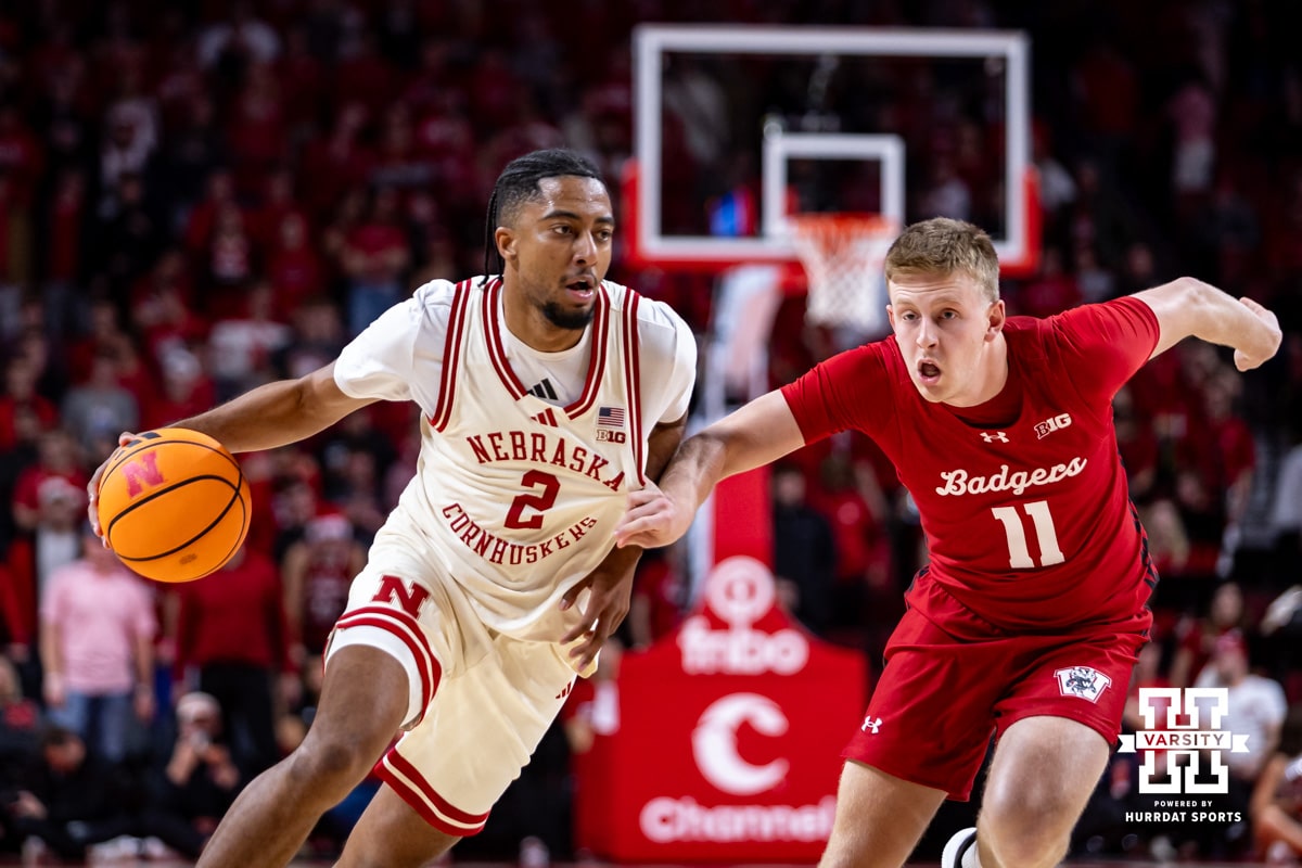 Nebraska Cornhusker guard Kendall Blue (2) dribbles the ball against Wisconsin Badger forward Jack Robison (11) in the second half during a college men’s basketball game on Wednesday, Dec. 10, 2025, in Lincoln, Nebraska. Photo by John S. Peterson.