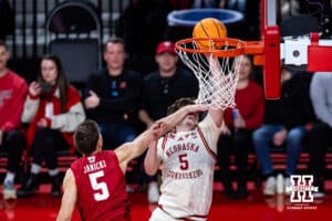 Nebraska Cornhusker forward Braden Frager (5) makes a lay up against Wisconsin Badger guard Jack Janicki (5) in the second half during a college men’s basketball game on Wednesday, Dec. 10, 2025, in Lincoln, Nebraska. Photo by John S. Peterson.