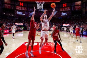Nebraska Cornhusker forward Rienk Mast (51) makes a lay up against Wisconsin Badger forward Nolan Winter (31) in the first half during a college men’s basketball game on Wednesday, Dec. 10, 2025, in Lincoln, Nebraska. Photo by John S. Peterson.