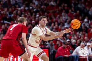 Nebraska Cornhusker guard Cale Jacobsen (31) makes a pass against Wisconsin Badger guard Andrew Rohde (7) in the first half during a college men’s basketball game on Wednesday, Dec. 10, 2025, in Lincoln, Nebraska. Photo by John S. Peterson.