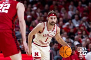 Nebraska Cornhusker guard Sam Hoiberg (1) dribbles the ball against Wisconsin Badger forward Austin Rapp (22) in the first half during a college men’s basketball game on Wednesday, Dec. 10, 2025, in Lincoln, Nebraska. Photo by John S. Peterson.