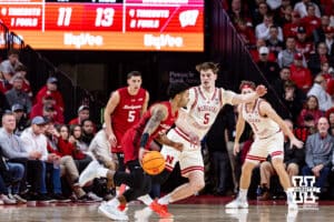 Nebraska Cornhusker forward Braden Frager (5) guards Wisconsin Badger guard Nick Boyd (2) in the first half during a college men’s basketball game on Wednesday, Dec. 10, 2025, in Lincoln, Nebraska. Photo by John S. Peterson.
