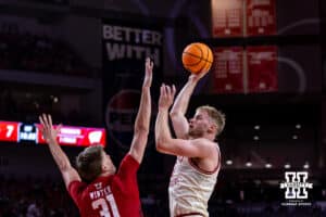 Nebraska Cornhusker forward Rienk Mast (51) makes a basket against Wisconsin Badger forward Nolan Winter (31) in the first half during a college men’s basketball game on Wednesday, Dec. 10, 2025, in Lincoln, Nebraska. Photo by John S. Peterson.