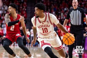 Nebraska Cornhusker guard Jamarques Lawrence (10) dribbles the ball against the Wisconsin Badgers in the first half during a college men’s basketball game on Wednesday, Dec. 10, 2025, in Lincoln, Nebraska. Photo by John S. Peterson.