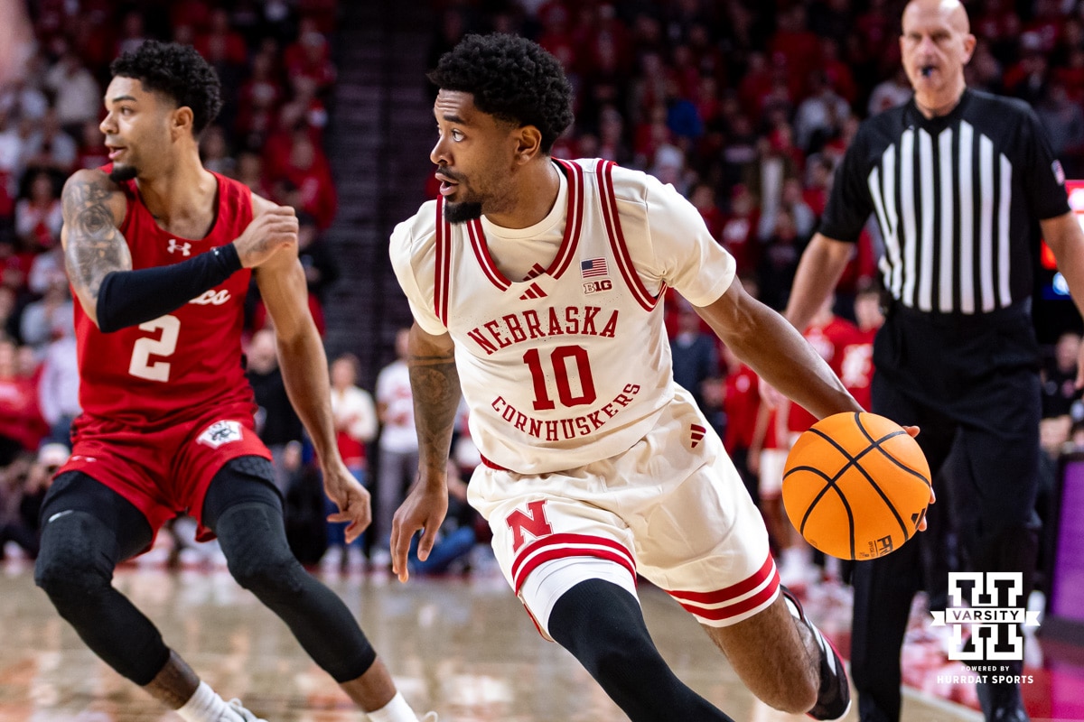 Nebraska Cornhusker guard Jamarques Lawrence (10) dribbles the ball against the Wisconsin Badgers in the first half during a college men’s basketball game on Wednesday, Dec. 10, 2025, in Lincoln, Nebraska. Photo by John S. Peterson.