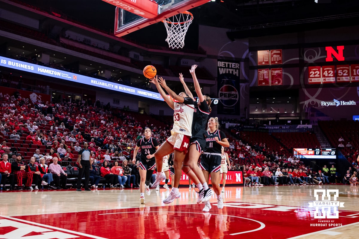 Nebraska Cornhusker forward Amiah Hargrove (33) makes a lay up against Omaha Maverick center Lillian Merow (33) in the second quarter during a college women’s basketball game on Tuesday, Dec. 9, 2025, in Lincoln, Nebraska. Photo by John S. Peterson.