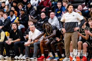 Lincoln Southeast head coach Joey Werning stands wioth his sideline and react to a big play by his offense during a high school basketball game against Lincoln Northstar on Friday, December 5, 2025, in Lincoln, Nebraska. Photo by Braden Cochran.