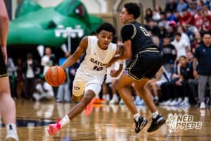 Lincoln North Star guard J'Shawn Afuh (10) pushes past Lincoln Southeast defender Rowan Lambert (0) during a high school basketball game on Firday, December 5, 2025, in Lincoln, Nebraska. Photo by Braden Cochran.