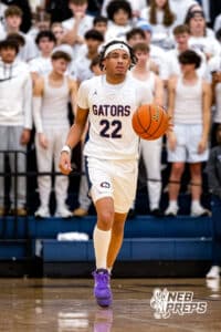 Lincoln North Star guard Jordan Castor (22) dribbles up the court with the ball against Lincoln Southeast during a high school basketball game on Friday, December 5, 2025, in Lincoln, Nebraska. Photo by Braden Cochran.