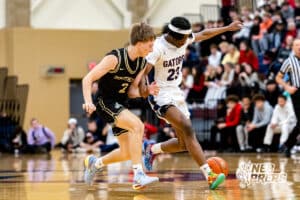 Lincoln Southeast’s Carter Chatelain (2) and Lincoln North Star guard Mekhi Jackson (23) go after a loose ball during a high school basketball game on Friday, December 5, 2025, in Lincoln, Nebraska. Photo by Braden Cochran.