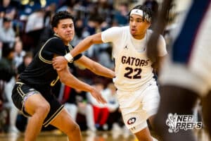 Lincoln North Star guard Jordan Castor (22) moves around a Lincoln Southeast defender during a high school basketball game on Friday, December 5, 2025, in Lincoln, Nebraska. Photo by Braden Cochran.