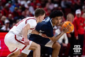 Creighton Bluejay guard Austin Swartz (1) dribbles the ball against Nebraska Cornhusker guard Cale Jacobsen (31) in the second half during a college basketball game on Sunday, Dec. 7, 2025, in Lincoln, Nebraska. Photo by John S. Peterson.