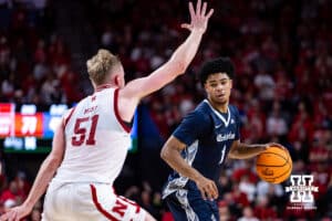 Creighton Bluejay guard Austin Swartz (1) dribbles the ball against Nebraska Cornhusker forward Rienk Mast (51) in the second half during a college basketball game on Sunday, Dec. 7, 2025, in Lincoln, Nebraska. Photo by John S. Peterson.