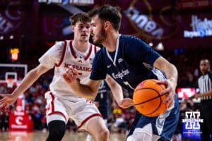 Creighton Bluejay guard Fedor Žugić (7) dribbles the ball along the baseline against Nebraska Cornhusker forward Braden Frager (5) in the second half during a college basketball game on Sunday, Dec. 7, 2025, in Lincoln, Nebraska. Photo by John S. Peterson.