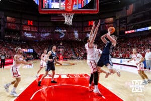Creighton Bluejay guard Josh Dix (4) takes a shot against Nebraska Cornhusker forward Berke Buyuktuncel (9) in the second half during a college basketball game on Sunday, Dec. 7, 2025, in Lincoln, Nebraska. Photo by John S. Peterson.