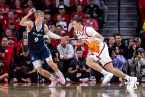 Nebraska Cornhusker guard Cale Jacobsen (31) dribbles to the basket against Creighton Bluejay guard Ty Davis (9) in the second half during a college basketball game on Sunday, Dec. 7, 2025, in Lincoln, Nebraska. Photo by John S. Peterson.