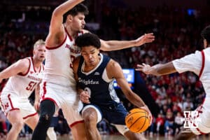 Creighton Bluejay forward Jasen Green (0) drives into Nebraska Cornhusker forward Berke Buyuktuncel (9) in the second half during a college basketball game on Sunday, Dec. 7, 2025, in Lincoln, Nebraska. Photo by John S. Peterson.