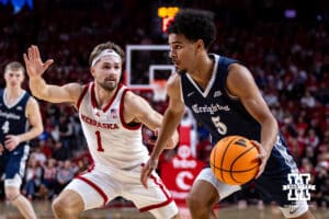 Creighton Bluejay guard Nik Graves (5) dribbles the ball against Nebraska Cornhusker guard Sam Hoiberg (1) in the second half during a college basketball game on Sunday, Dec. 7, 2025, in Lincoln, Nebraska. Photo by John S. Peterson.