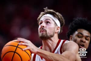 Nebraska Cornhusker guard Sam Hoiberg (1) drives to the basket for a lay up against Creighton Bluejay guard Austin Swartz (1) in the first half during a college basketball game on Sunday, Dec. 7, 2025, in Lincoln, Nebraska. Photo by John S. Peterson.