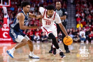 Nebraska Cornhusker forward Braden Frager (5) dribbles the ball against Creighton Bluejay guard Nik Graves (5) in the first half during a college basketball game on Sunday, Dec. 7, 2025, in Lincoln, Nebraska. Photo by John S. Peterson.