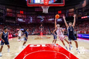 Nebraska Cornhusker guard Sam Hoiberg (1) drives to the basket for a lay up against Creighton Bluejay forward Isaac Traudt (41) in the first half during a college basketball game on Sunday, Dec. 7, 2025, in Lincoln, Nebraska. Photo by John S. Peterson.