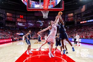 Nebraska Cornhusker forward Rienk Mast (51) and Creighton Bluejay guard Blake Harper (2) go for the rebound in the first half during a college basketball game on Sunday, Dec. 7, 2025, in Lincoln, Nebraska. Photo by John S. Peterson.